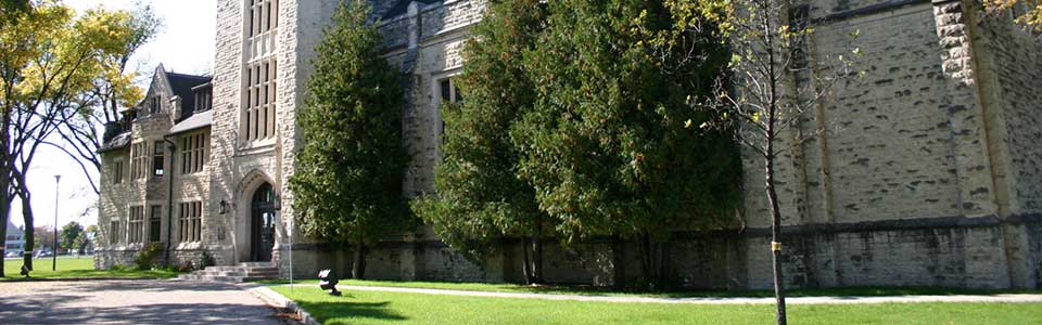 Canadian Mennonite University campus image, old stone building.