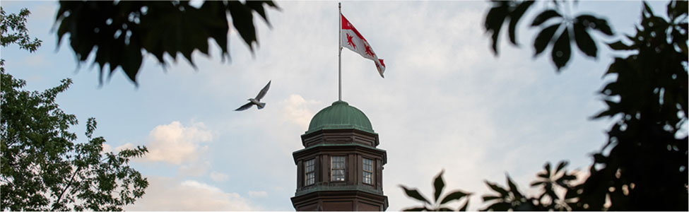McGill University campus shot with Canadian flag